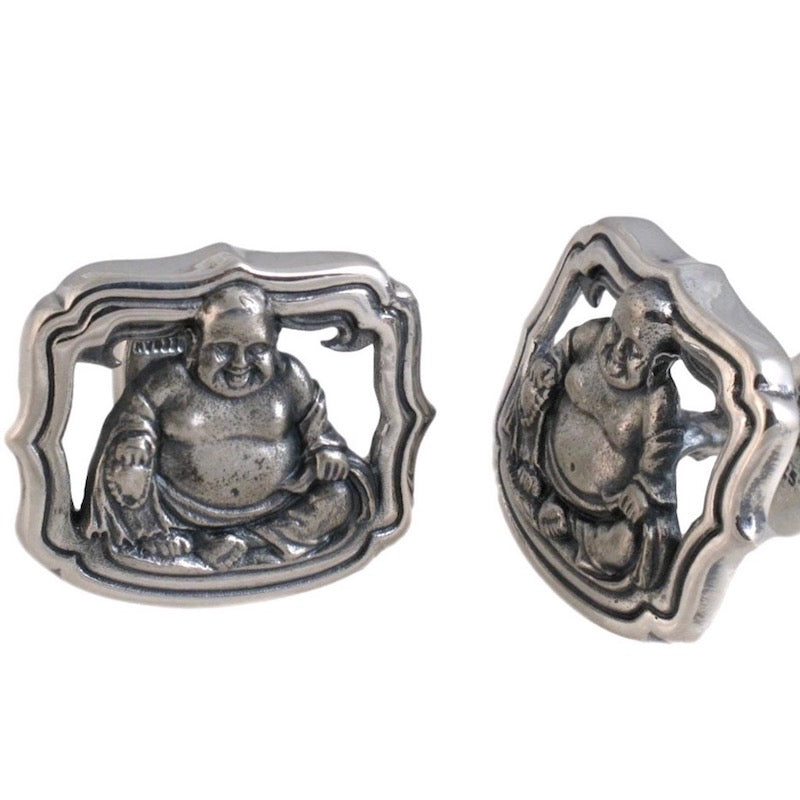 The cufflink collection is represented here by the Laughing Buddha cufflinks, made of sterling. The Buddha is sitting in an open carved frame.