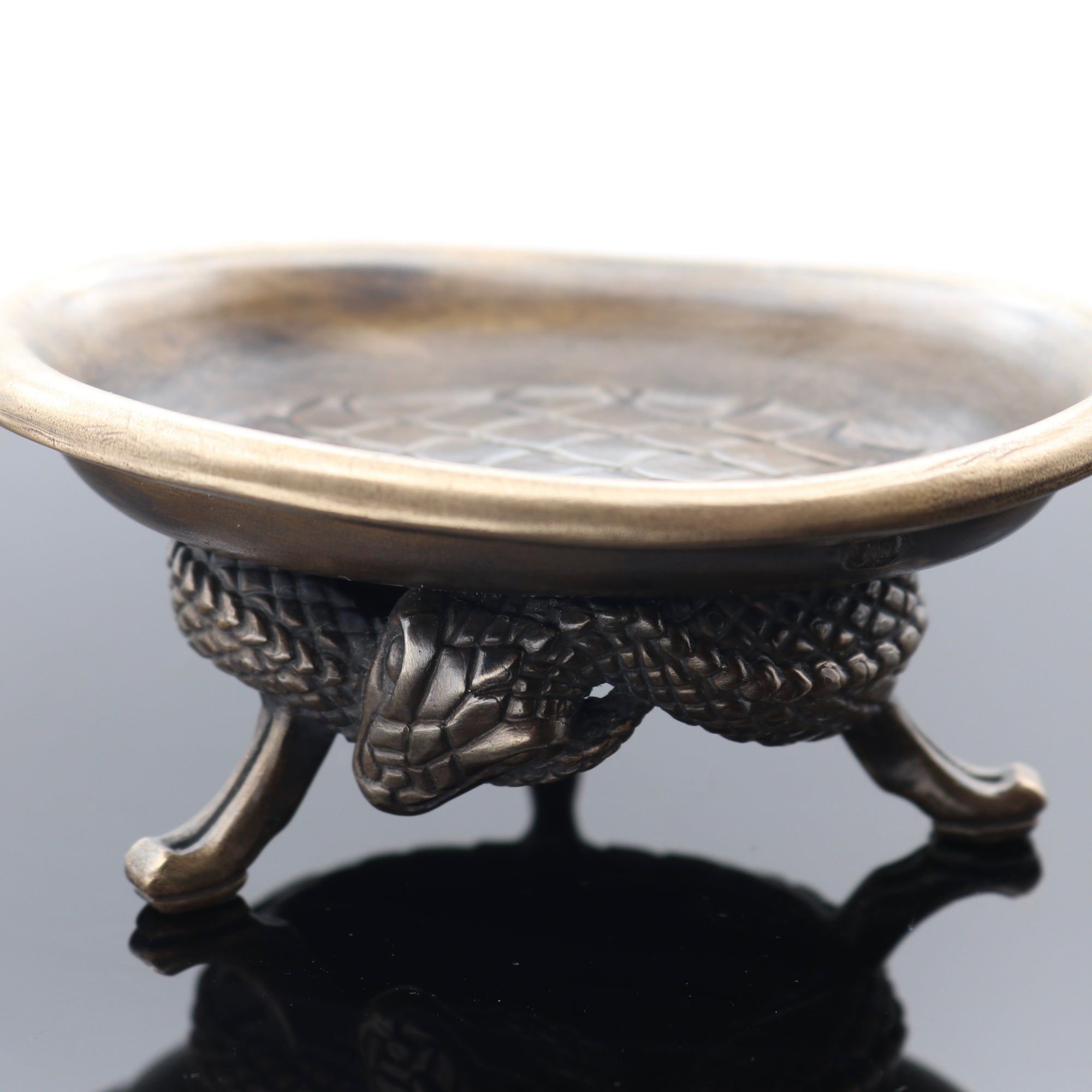 The Bronze Coiled Snake Footed Desk Valet in Bronze. The oval dish is carved with Snake Skin detail and will fit keys or other small items.