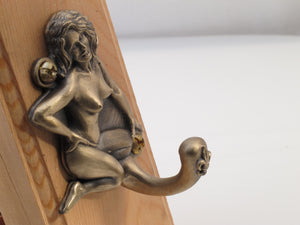 Bronze Jada Pin Up Hook, depicts exotic dancer Jada of New Orleans in the 1960's