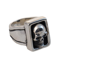 "Large Skull Boxed Ring, sterling seen from an angle."