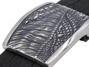 Angled view from above of the sterling T Rex Skin Plaque buckle showing the deep texturing of the carved donosaur skin in contrast to the smooth polished edges.