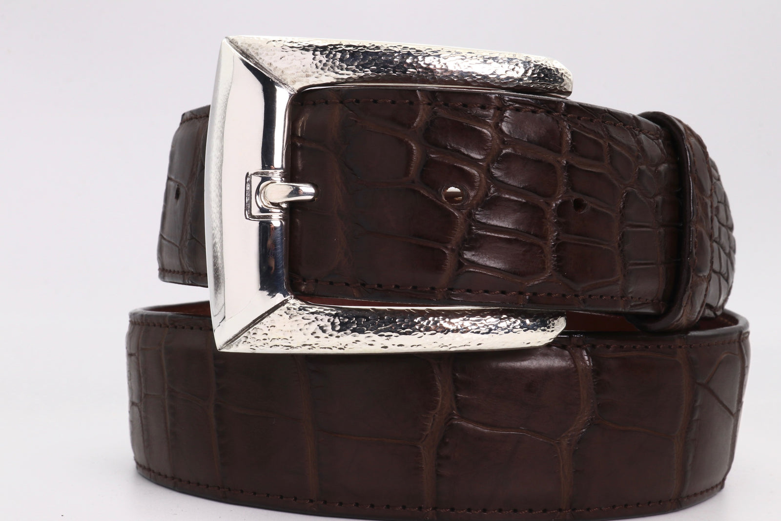 Style #1393, classic harness buckle with polished and hammer texture finish. Shown on black alligator strap.