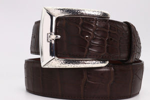 Image of style #1393 hammer textured clean lined harness buckle for 1.5" straps. Shown on a coiled brown strap.