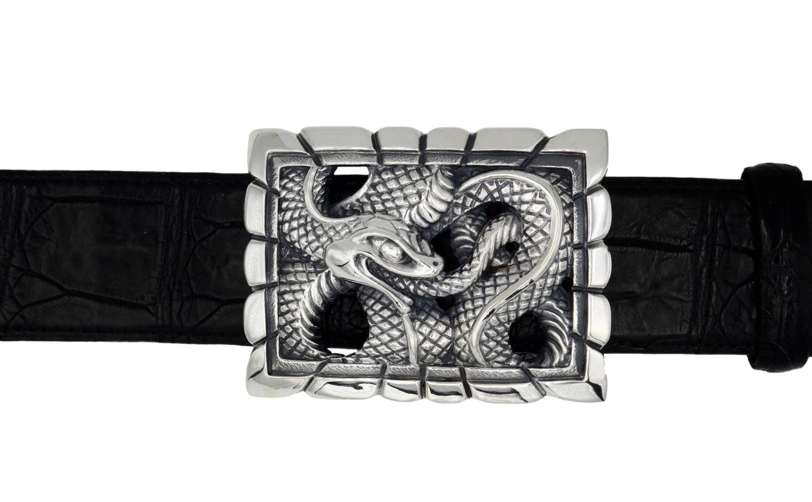 The Ouroboros Scalloped trophy style buckle, in Sterling, is shown in a front facing image on a black belt. 