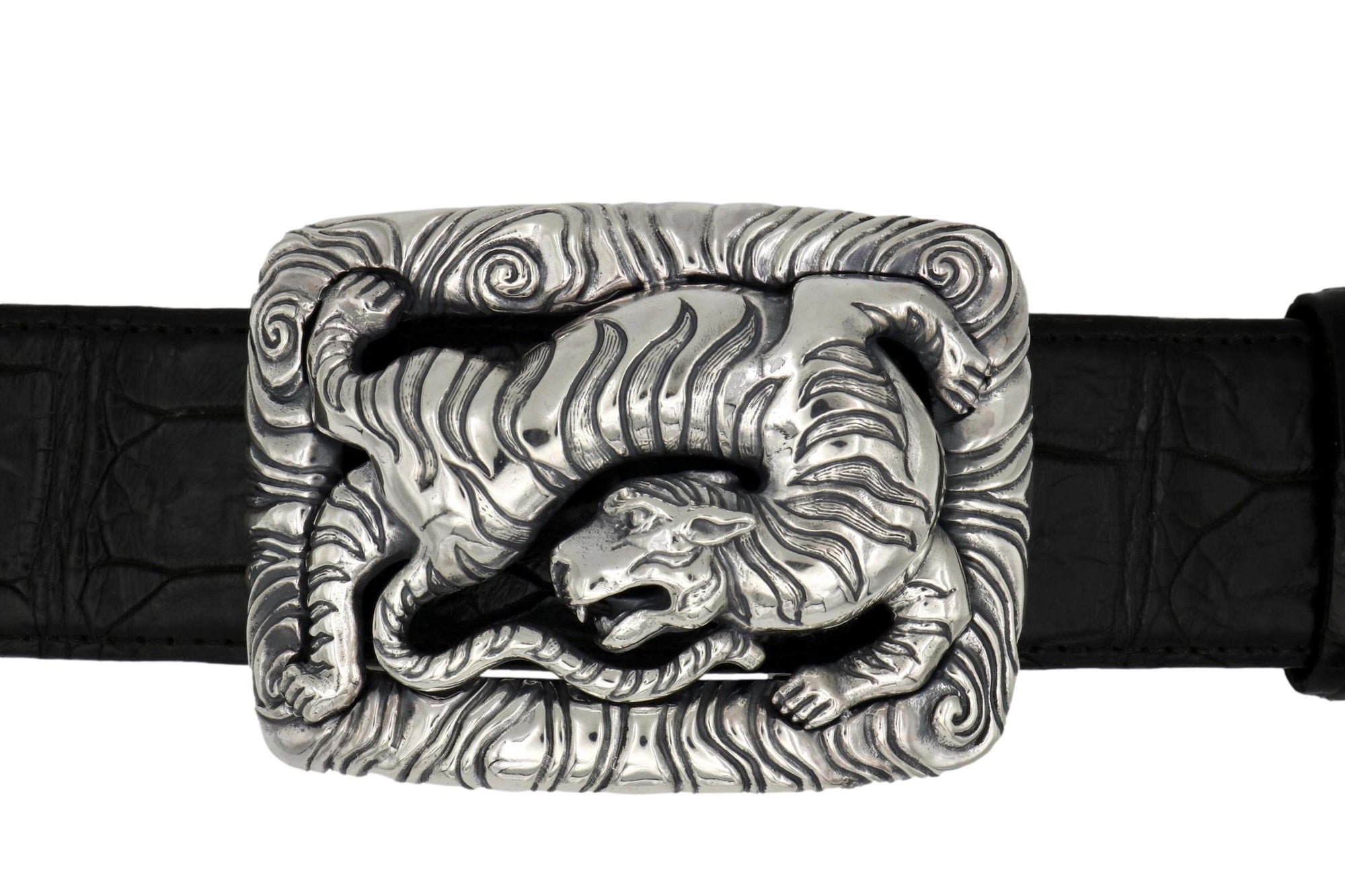 Front view of the Back Flipping Tiger buckle, showing the Tiger set into the elaborately carved surrounding frame. On a black alligator belt.
