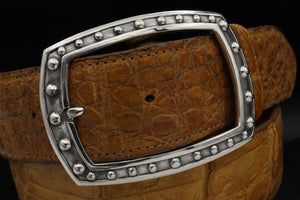 Close up of the Sterling Beaded Frame, Centre bar buckle [garrison style]. Shown on a tan Alligator belt that is 1.5" wide.