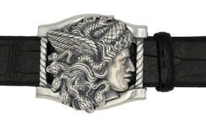 Sterling buckle Medusa head, carved as a side view. It sits on a base frame accented with twist detail.