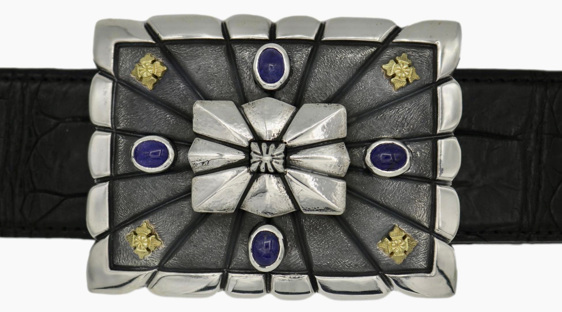 Sterling scalloped edge rectangular buckle with ribbed centre shield, features 4 bezel set tanzanite cabs and 18kt accents in each corner. Top view on black alligator strap.