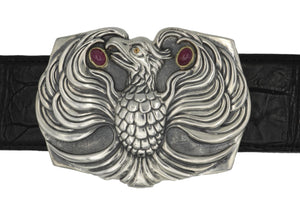 The Phoenix sterling buckle accented with 18kt gold bezel set ruby cabs and a dark yellow spessaratine eye.