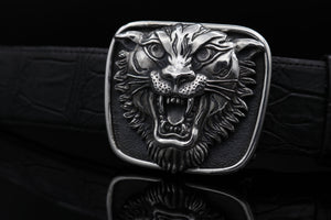Image of the Sterling Silver Tiger Head Trophy buckle., looking straight on . Tiger has its mouth open in full growl pose.