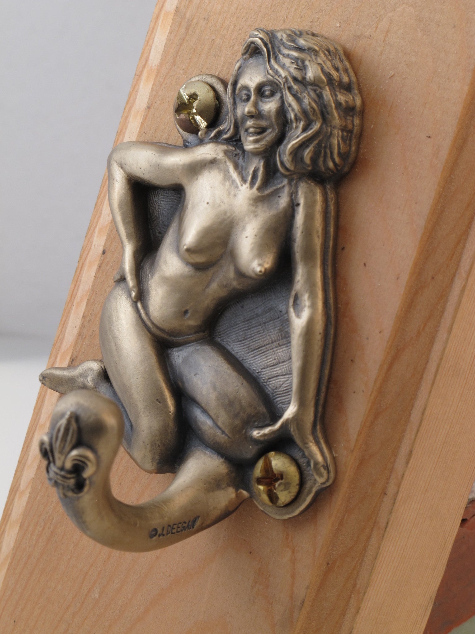 Bronze Jada Pin Up Hook, depicts exotic dancer Jada of New Orleans in the 1960's