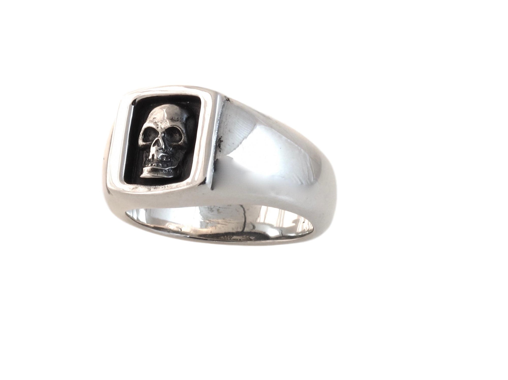 #DR - 16 Sterling Small Boxed Skull Ring seen from front."