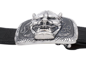 Side view of the Hanya Mask buckle in sterling. This view clearly shows the bold elevation of the mask on the buckle base.