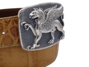 Angular view of the Sterling Griffin buckle with a coiled tan alligator strap.
